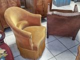 a chair and a chair in a room with a lot of furniture