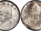 a close up of a coin with a man ' s face on it