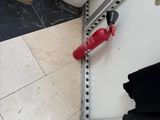 a red fire hydrant sitting on the floor next to a box