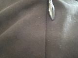 a close up of a zipper on a black jacket