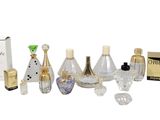 many different types of perfumes and bottles in this picture