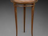 a small table with a wooden top and two legs