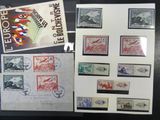 several different stamps are on display on a black table