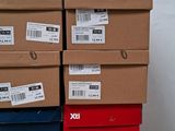 several boxes stacked on top of each other with labels on them