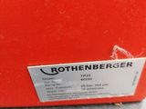 an orange box with a label on it sitting on a table