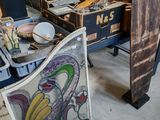 several pieces of art are sitting on a table in a room