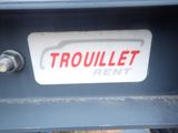 a sign that says trouillet rent on the back of a truck