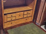 a wooden desk with a drawer underneath it