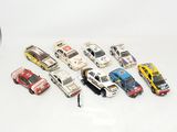 a lot of toy cars that are on a white surface