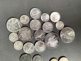 a lot of coins that are on the table