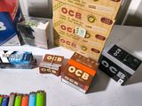 many different types of cigarettes and other items on the table