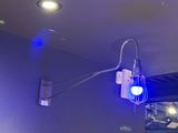 a blue light that is on a wall in a room