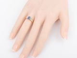 an image of a woman ' s hand with a ring on it