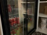 a refrigerator that has a lot of drinks inside of it
