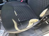 a dirty seat in the back of a car