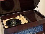 a record player that is sitting on top of a table