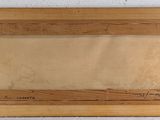 an old picture frame hanging on a wall with a white background