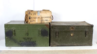 two trunks sitting on top of each other on a shelf