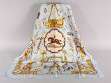 an image of a blue and gold scarf with a horse on it