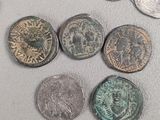 some coins are sitting on a table with a white background