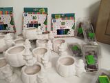 a lot of white pottery items sitting on a table