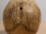 a ball with writing on it sitting on a table