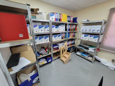 a room filled with lots of boxes and shelves