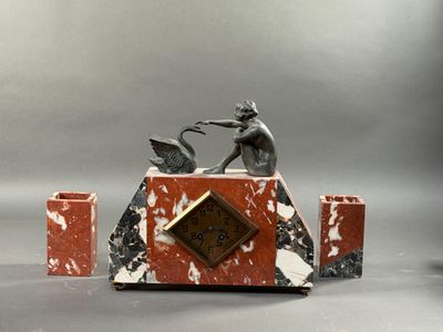 a statue of a man and a woman on top of a clock