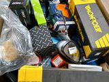 a cardboard box filled with assorted electronic devices