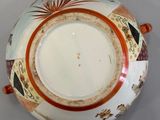 a white plate with a design on it sitting on a table