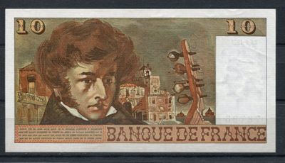 un gros plan sur un billet sur lequel figure la photo d'un homme
