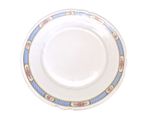 a white plate with blue and pink designs on it