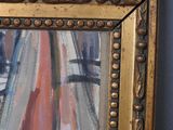 an image of a painting of a sailboat in a gold frame on a blue wall