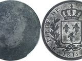 an old silver coin with a coat of arms on it