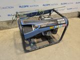 the generator is sitting on the floor in front of the wall