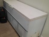 an image of a white chest of drawers in a garage