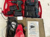 a red box with tools in it sitting on the floor