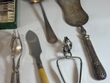 many different types of spoons and utensils laid out on a table