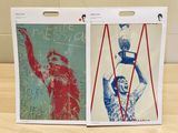 a picture of a pair of posters on a table