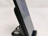 a cell phone that is sitting on a stand