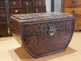 a wooden chest with a lock on it on a wooden floor