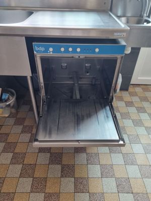 an image of a kitchen with a sink and a dishwasher