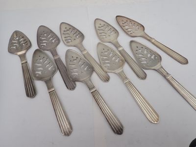 five spoons and six spoons on a table