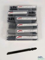 Lot de 100 lames de scie sauteuse.