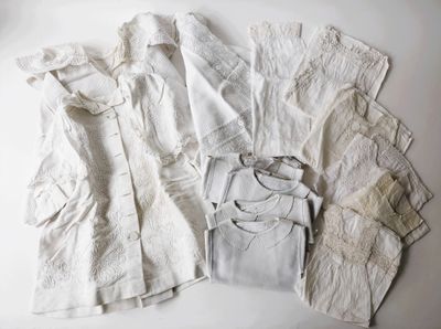 a pile of white clothing on a white surface
