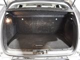 the back of a car with its trunk open and the back door open