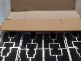 a cardboard box with a black and white pattern inside of it
