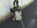 a broken pressurer on the ground next to a wall
