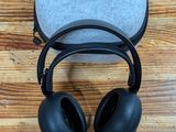 an image of a pair of headphones sitting on top of a wooden floor