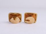 a pair of gold plated earrings with a bird on it